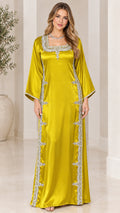 Front view of model wearing chartreuse satin embellished maxi kaftan dress