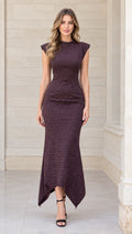 Front view of woman wearing burgundy houndstooth cap sleeve maxi dress with asymmetrical hem