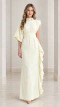 Full front view of butter yellow asymmetrical one-sleeve maxi dress with floral collar and side ruffle