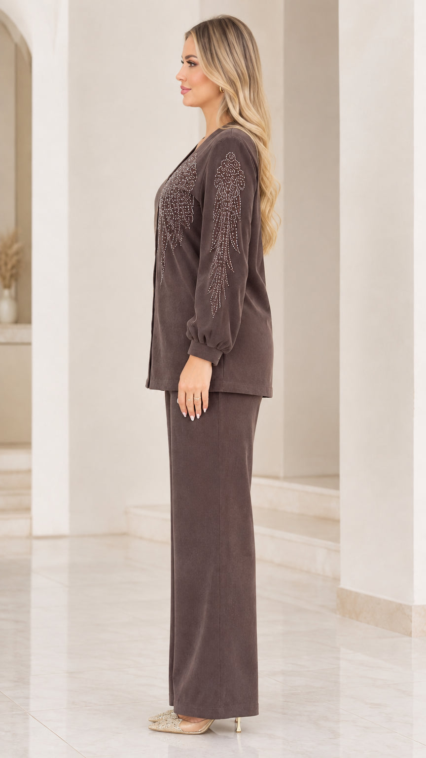 Side profile view of woman modeling brown ribbed two-piece pant set