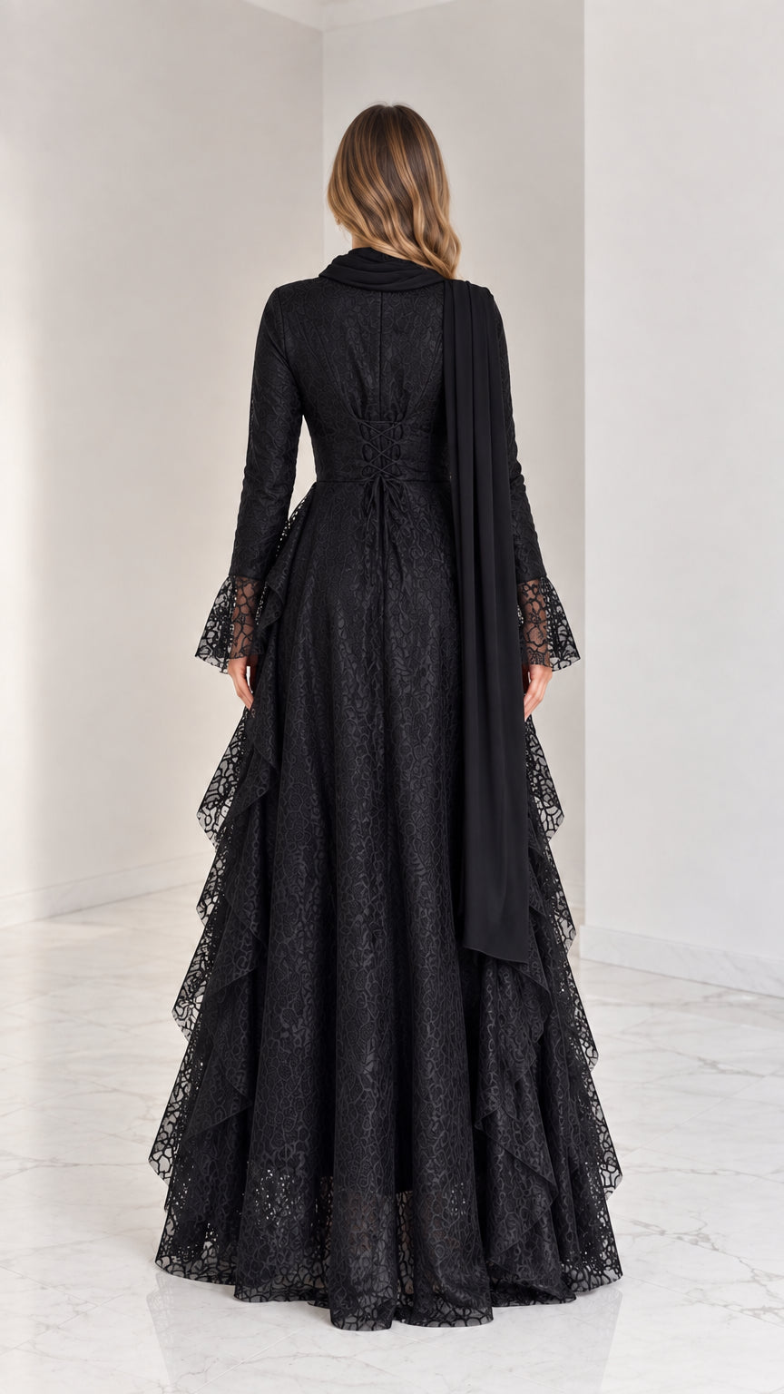 Back view of long sleeve black lace formal dress showing floor-length drape