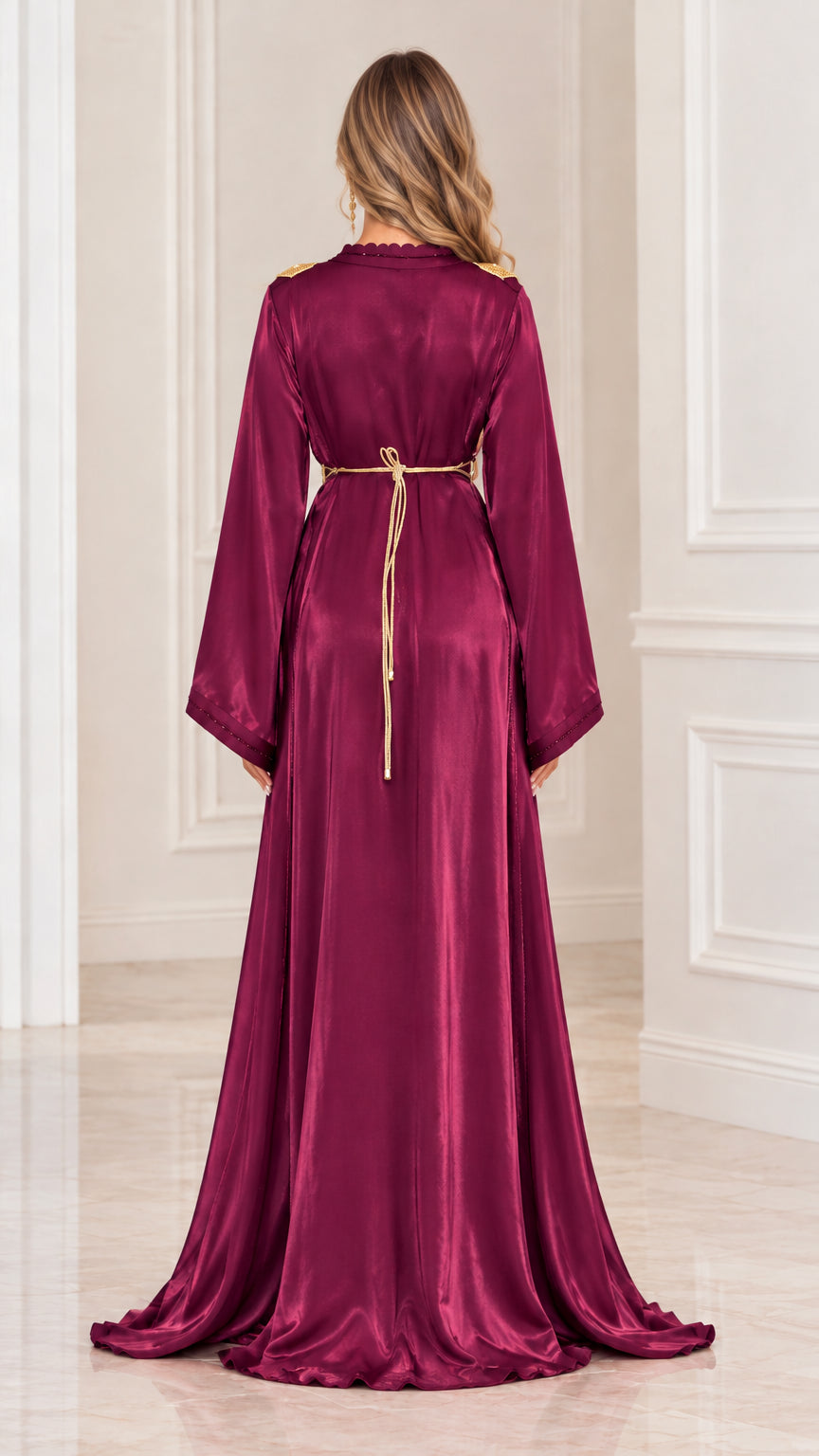 Back view of woman wearing burgundy satin maxi gown with tie detail