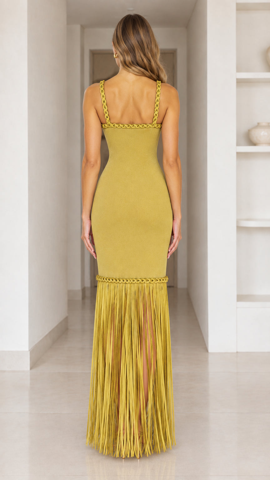 Back view of woman in Chartreuse sleeveless fringe maxi dress