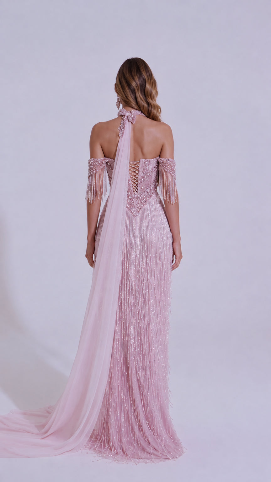 Back view of Blush Pink gown showcasing lace-up corset detail and long back train