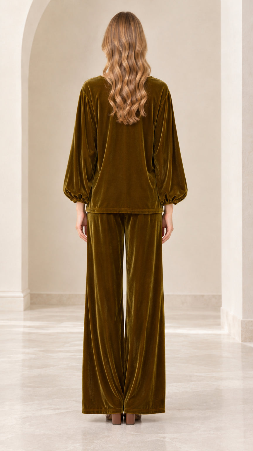 Back view of model wearing olive green velvet pant set