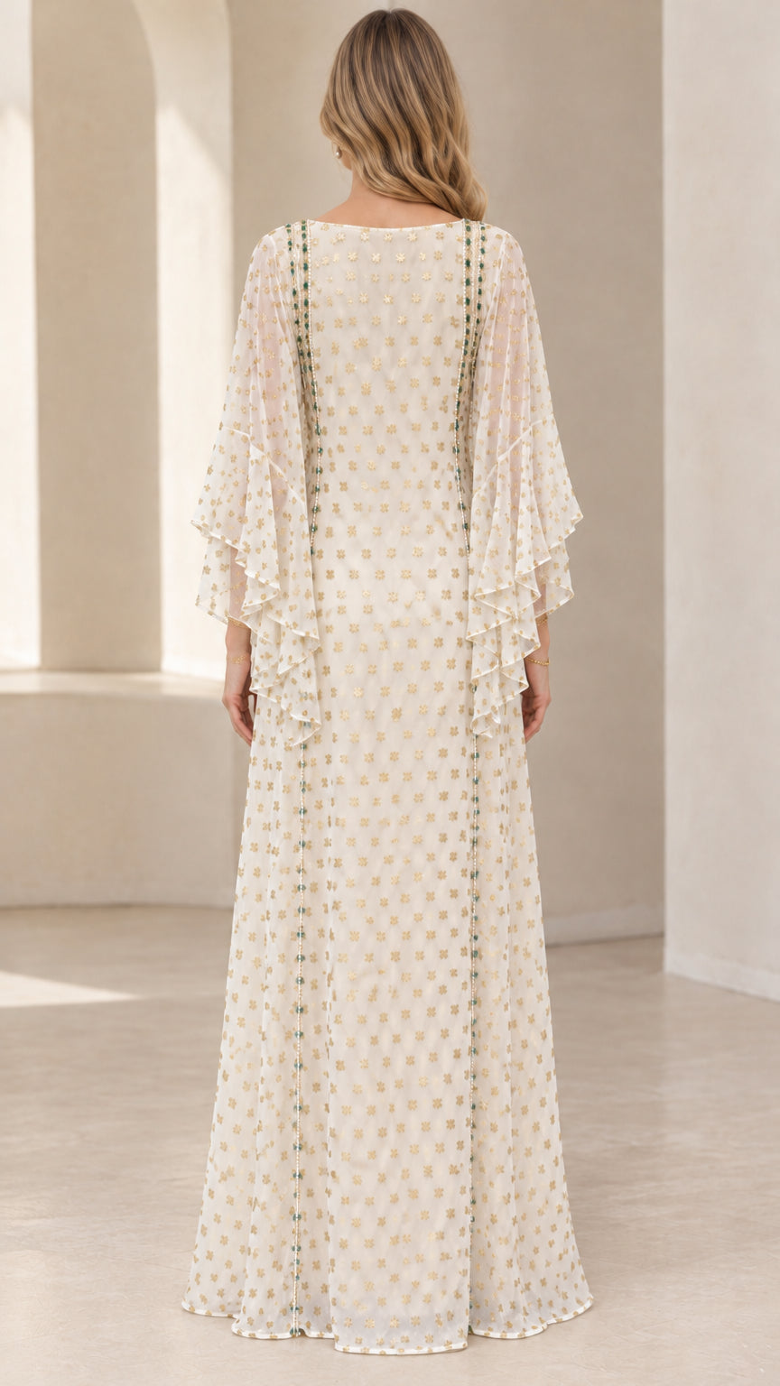 Back view of woman wearing elegant ivory kaftan dress with flowing draped sleeves