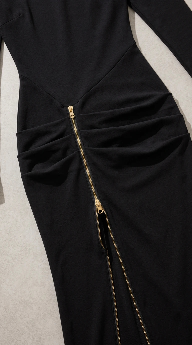 Close-up detail of gathered ruched waist and metallic exposed zipper