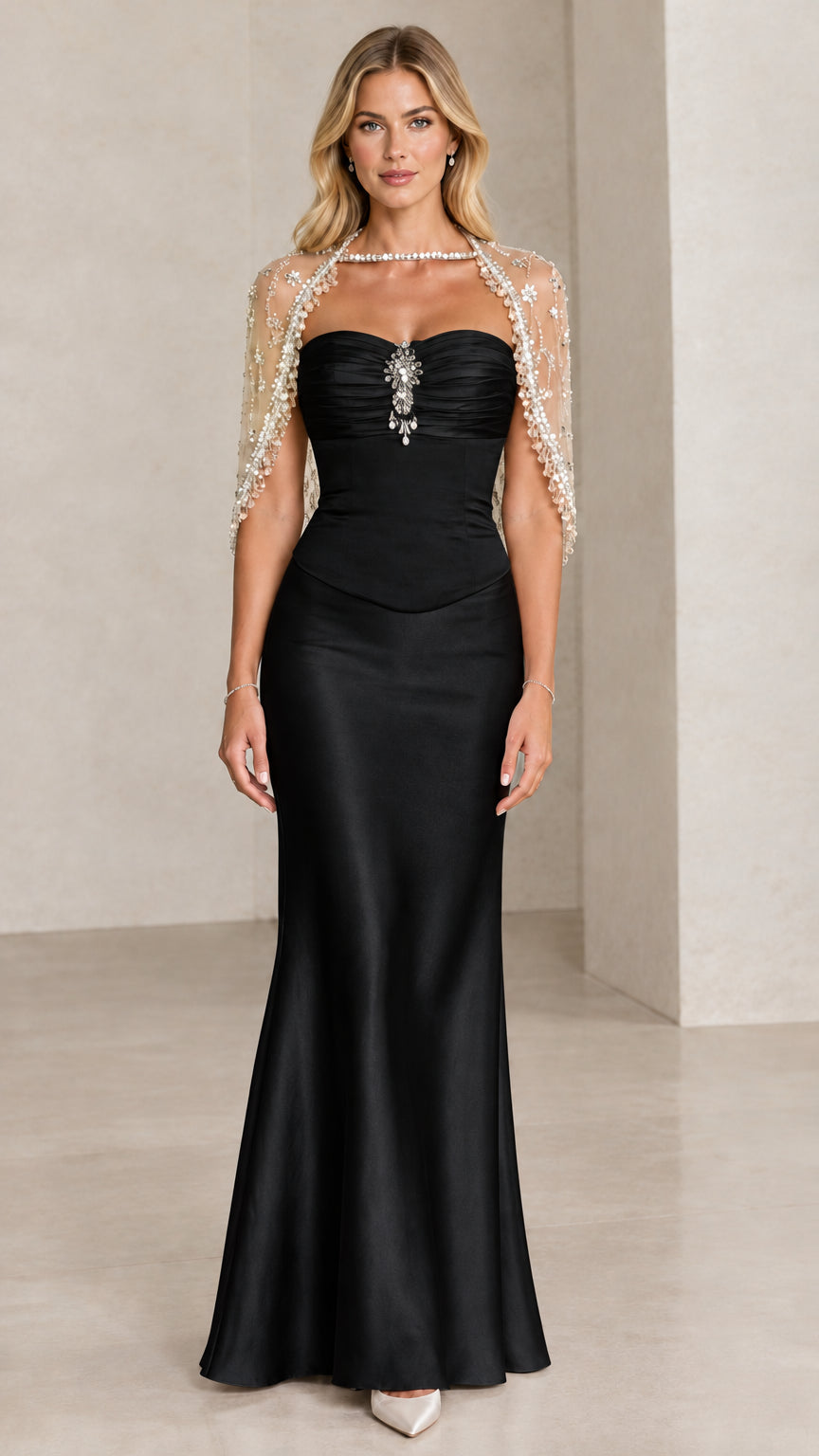 Front view of Black satin sweetheart evening gown with beaded capelet