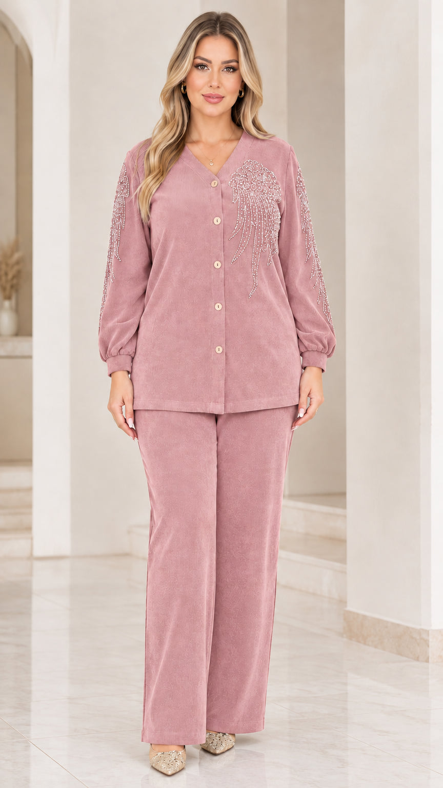 Front view of woman wearing dusty rose pink ribbed two-piece pant set