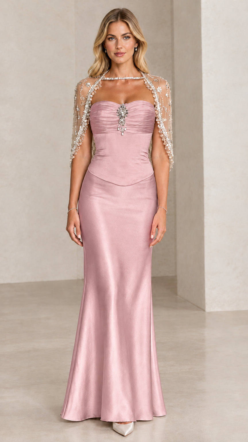 Front view of Blush Pink satin formal gown with embellished capelet