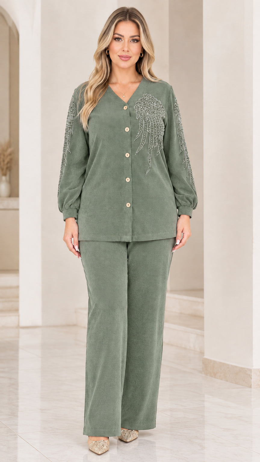 Front view of woman wearing sage green ribbed two-piece pant set