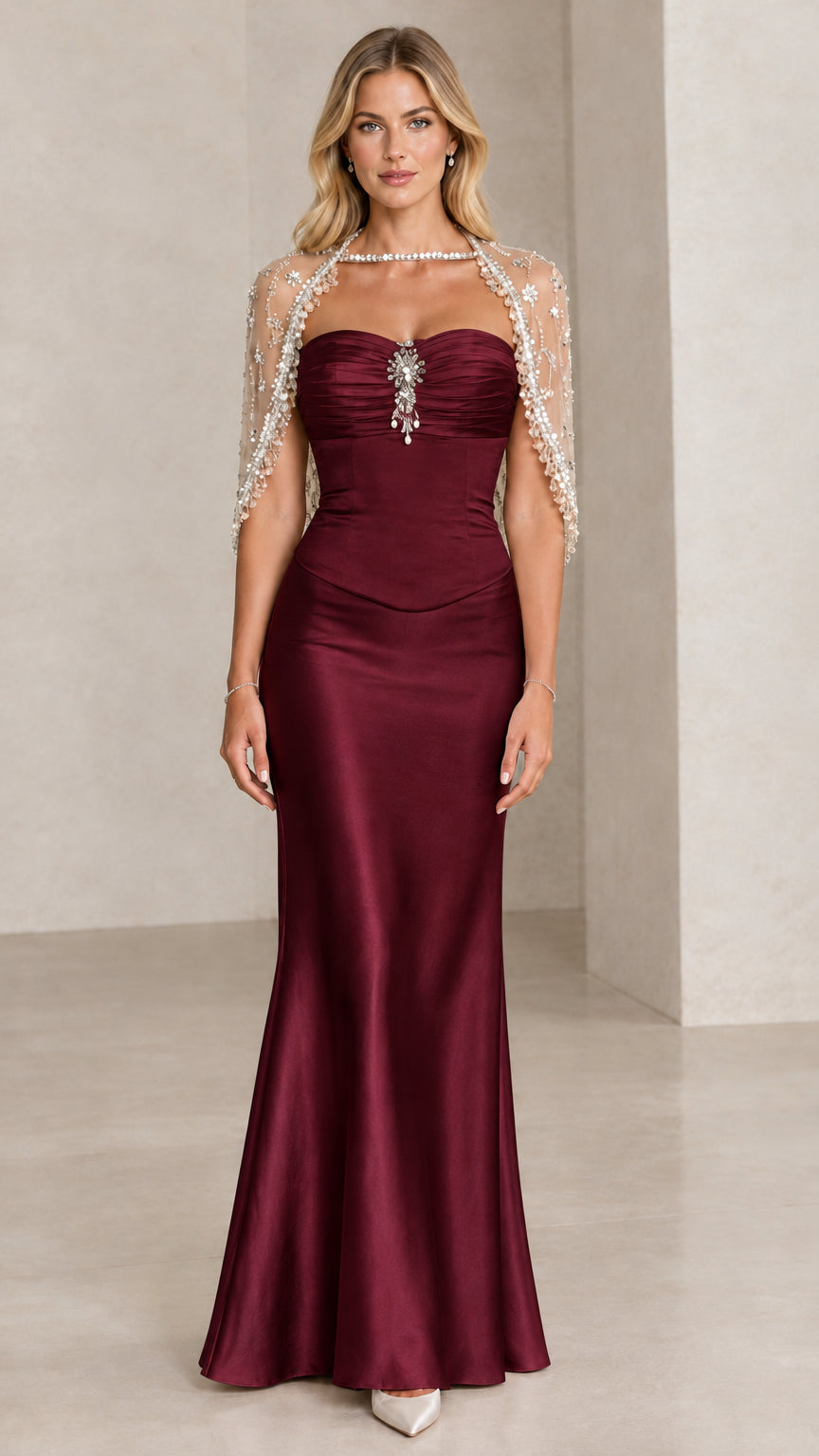 Front view of Burgundy wine satin formal evening gown with beaded capelet