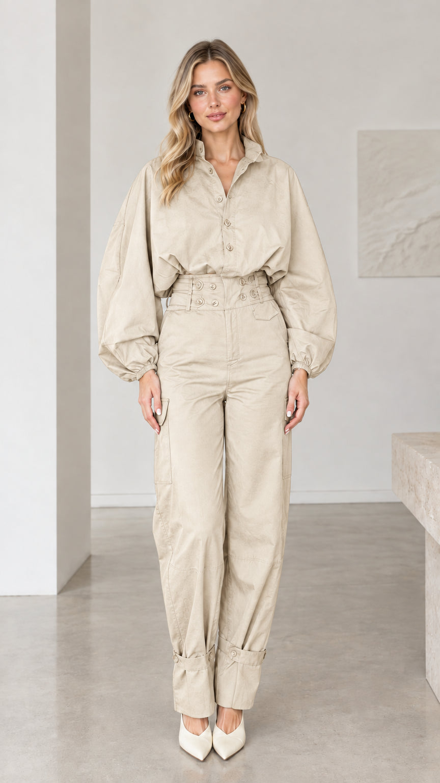 Front view of woman wearing neutral beige khaki long sleeve cargo jumpsuit