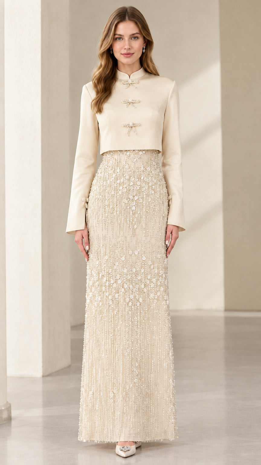 Model wearing Champagne cream cropped jacket and beaded column evening dress